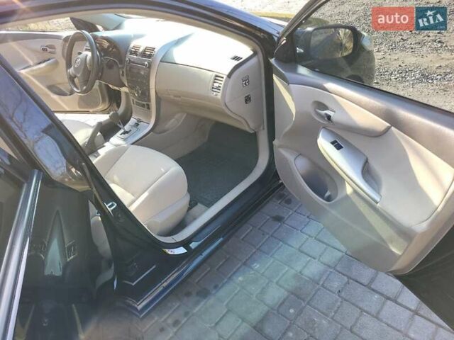 Чорний Тойота Королла, об'ємом двигуна 1.6 л та пробігом 195 тис. км за 8500 $, фото 9 на Automoto.ua