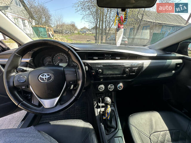 Чорний Тойота Королла, об'ємом двигуна 1.33 л та пробігом 219 тис. км за 9400 $, фото 12 на Automoto.ua