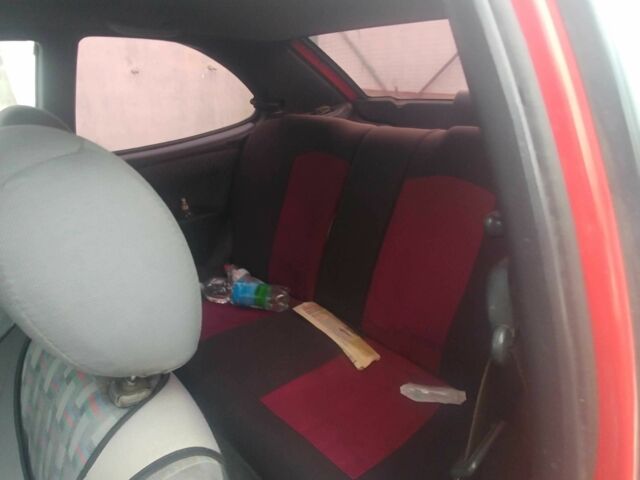 Червоний Тойота Королла, об'ємом двигуна 1.3 л та пробігом 289 тис. км за 2100 $, фото 7 на Automoto.ua