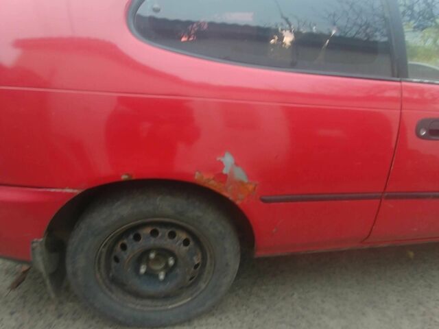 Червоний Тойота Королла, об'ємом двигуна 1.3 л та пробігом 289 тис. км за 2100 $, фото 3 на Automoto.ua