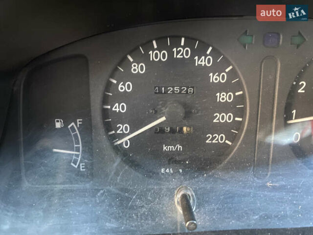 Красный Тойота Королла, объемом двигателя 1.33 л и пробегом 412 тыс. км за 2500 $, фото 8 на Automoto.ua