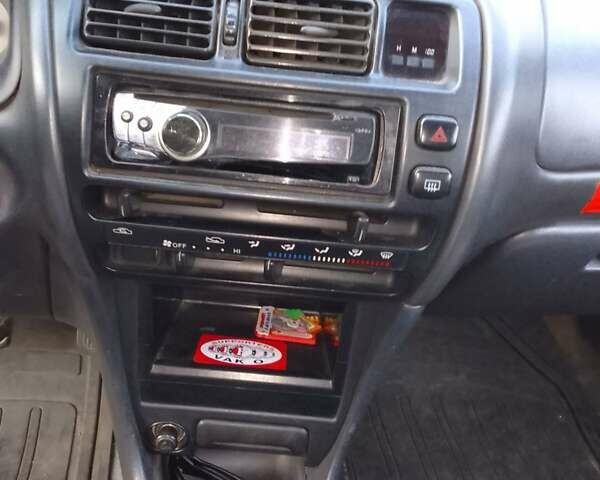 Червоний Тойота Королла, об'ємом двигуна 1.33 л та пробігом 335 тис. км за 2000 $, фото 6 на Automoto.ua