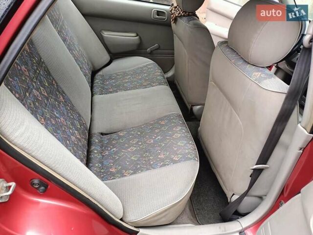 Червоний Тойота Королла, об'ємом двигуна 1.4 л та пробігом 270 тис. км за 1300 $, фото 25 на Automoto.ua