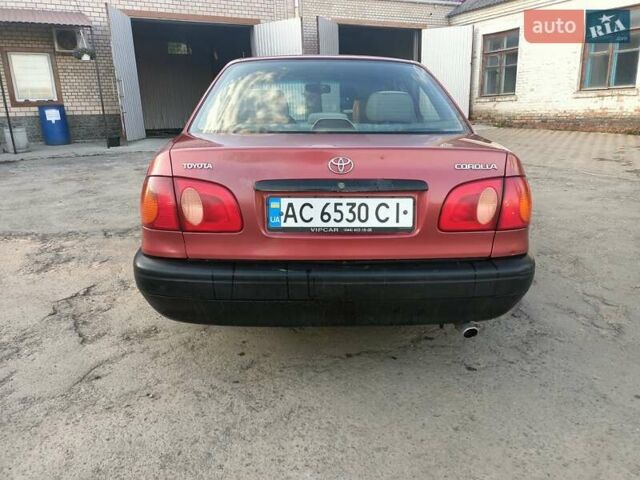 Червоний Тойота Королла, об'ємом двигуна 1.4 л та пробігом 270 тис. км за 1300 $, фото 4 на Automoto.ua
