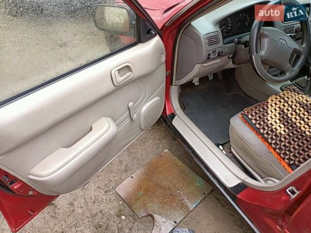 Червоний Тойота Королла, об'ємом двигуна 1.4 л та пробігом 270 тис. км за 1300 $, фото 19 на Automoto.ua