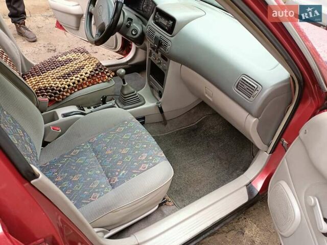 Червоний Тойота Королла, об'ємом двигуна 1.4 л та пробігом 270 тис. км за 1300 $, фото 23 на Automoto.ua