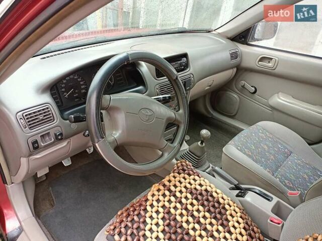 Червоний Тойота Королла, об'ємом двигуна 1.4 л та пробігом 270 тис. км за 1300 $, фото 22 на Automoto.ua