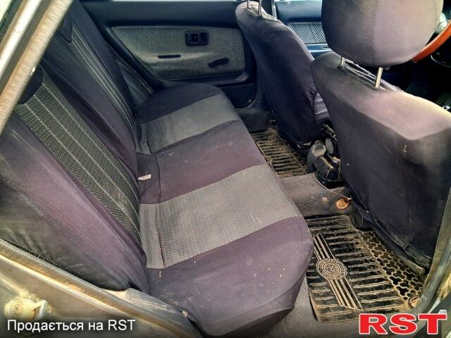 Сірий Тойота Королла, об'ємом двигуна 1.3 л та пробігом 236 тис. км за 900 $, фото 5 на Automoto.ua