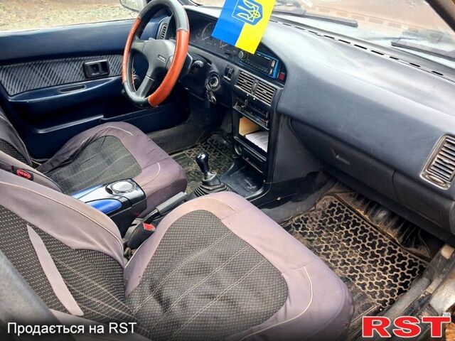 Сірий Тойота Королла, об'ємом двигуна 1.3 л та пробігом 236 тис. км за 900 $, фото 4 на Automoto.ua