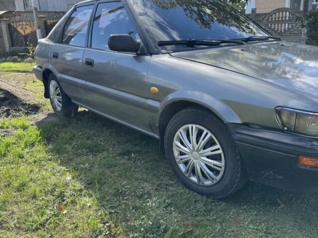 Серый Тойота Королла, объемом двигателя 1.3 л и пробегом 350 тыс. км за 1750 $, фото 1 на Automoto.ua