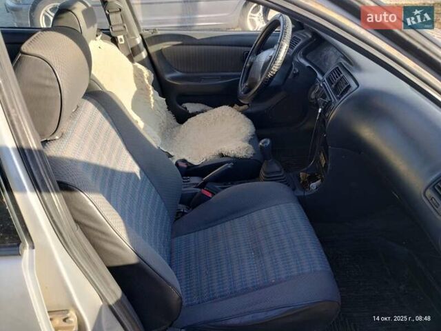 Серый Тойота Королла, объемом двигателя 1.33 л и пробегом 398 тыс. км за 1999 $, фото 11 на Automoto.ua