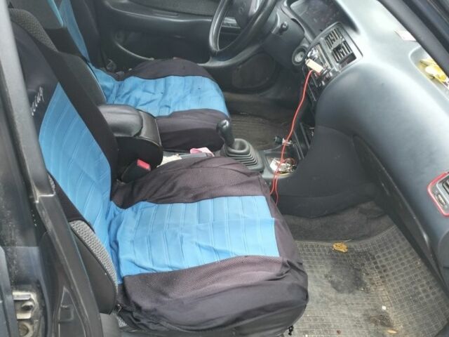 Серый Тойота Королла, объемом двигателя 1.3 л и пробегом 250 тыс. км за 500 $, фото 5 на Automoto.ua