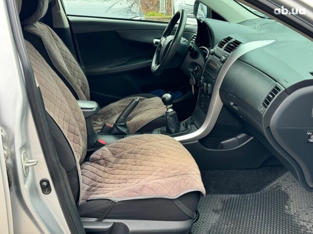 Сірий Тойота Королла, об'ємом двигуна 1.3 л та пробігом 137 тис. км за 7490 $, фото 19 на Automoto.ua