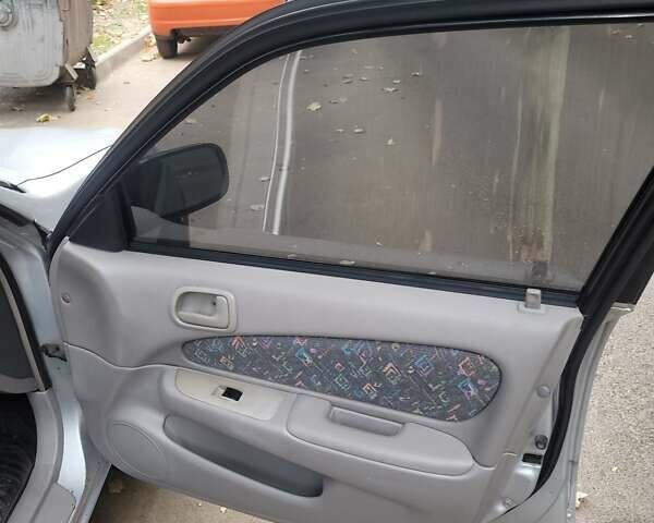 Серый Тойота Королла, объемом двигателя 1.33 л и пробегом 289 тыс. км за 3600 $, фото 4 на Automoto.ua