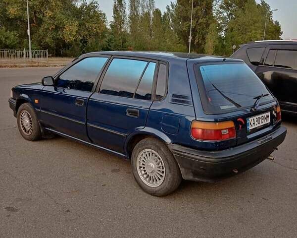 Синий Тойота Королла, объемом двигателя 1.3 л и пробегом 303 тыс. км за 2000 $, фото 2 на Automoto.ua