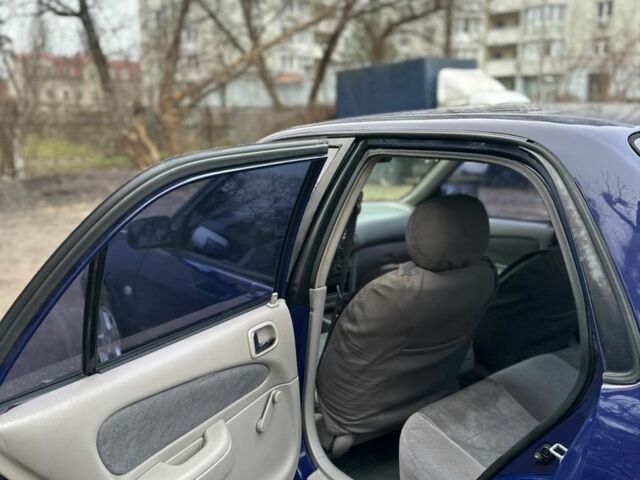 Синий Тойота Королла, объемом двигателя 1.4 л и пробегом 300 тыс. км за 1999 $, фото 8 на Automoto.ua