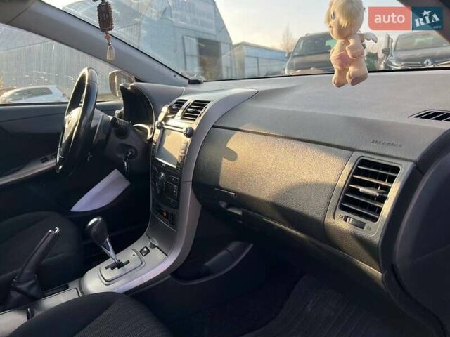 Синій Тойота Королла, об'ємом двигуна 1.6 л та пробігом 198 тис. км за 8690 $, фото 37 на Automoto.ua