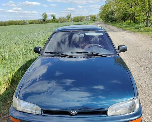 Синий Тойота Королла, объемом двигателя 2 л и пробегом 320 тыс. км за 2000 $, фото 3 на Automoto.ua