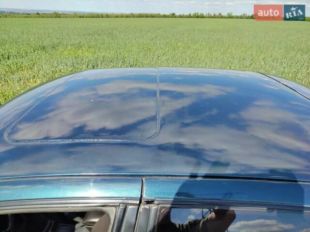 Синий Тойота Королла, объемом двигателя 2 л и пробегом 320 тыс. км за 2000 $, фото 2 на Automoto.ua