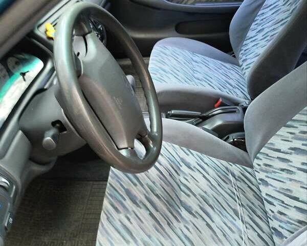 Зеленый Тойота Королла, объемом двигателя 1.3 л и пробегом 400 тыс. км за 2500 $, фото 10 на Automoto.ua