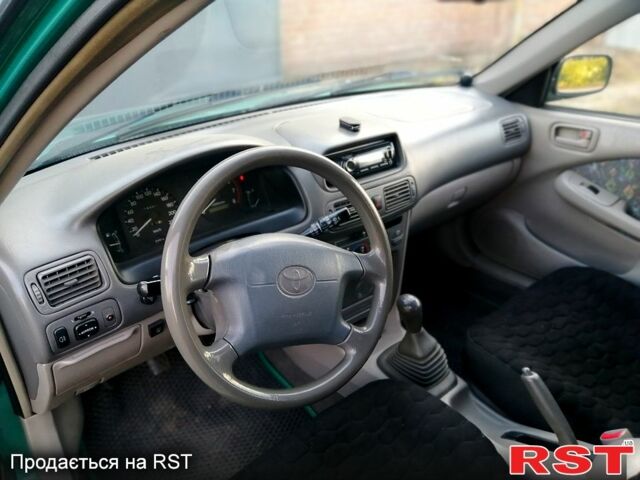 Зелений Тойота Королла, об'ємом двигуна 1.3 л та пробігом 215 тис. км за 1850 $, фото 3 на Automoto.ua