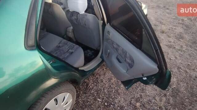 Зеленый Тойота Королла, объемом двигателя 1 л и пробегом 290 тыс. км за 2800 $, фото 5 на Automoto.ua