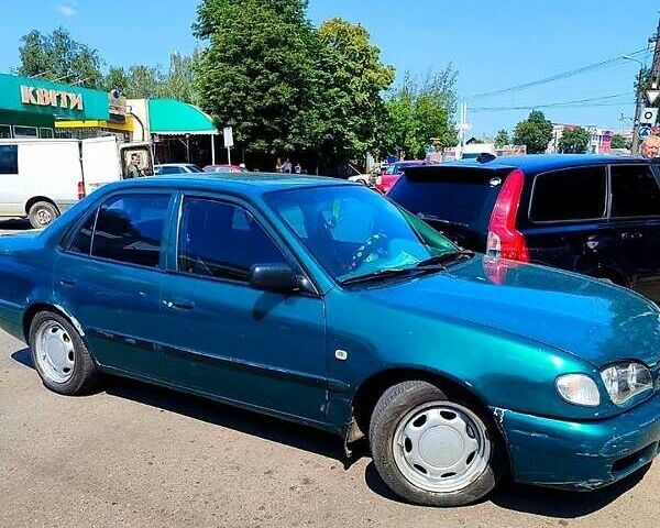 Зеленый Тойота Королла, объемом двигателя 1.4 л и пробегом 400 тыс. км за 4800 $, фото 10 на Automoto.ua