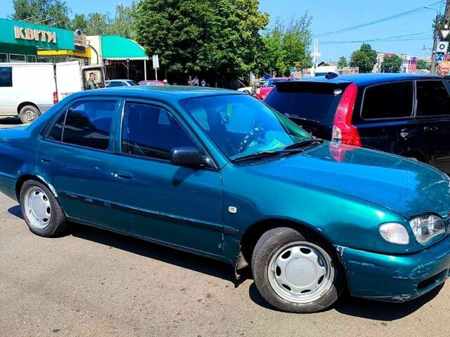 Зеленый Тойота Королла, объемом двигателя 1.4 л и пробегом 400 тыс. км за 4800 $, фото 11 на Automoto.ua