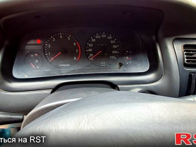 Зеленый Тойота Королла, объемом двигателя 1.3 л и пробегом 300 тыс. км за 3000 $, фото 7 на Automoto.ua