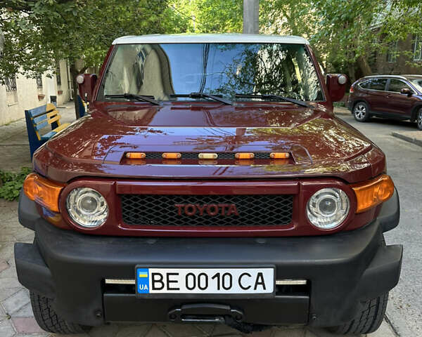 Красный Тойота ФЖ Крузер, объемом двигателя 4 л и пробегом 252 тыс. км за 17000 $, фото 1 на Automoto.ua