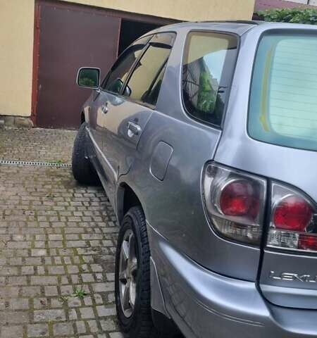 Сірий Тойота Харріер, об'ємом двигуна 3 л та пробігом 243 тис. км за 9500 $, фото 1 на Automoto.ua