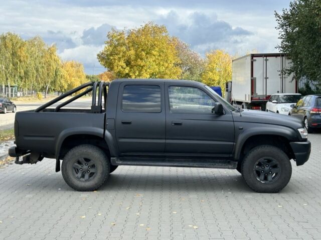 Чорний Тойота Хайлюкс, об'ємом двигуна 2.5 л та пробігом 200 тис. км за 5450 $, фото 1 на Automoto.ua