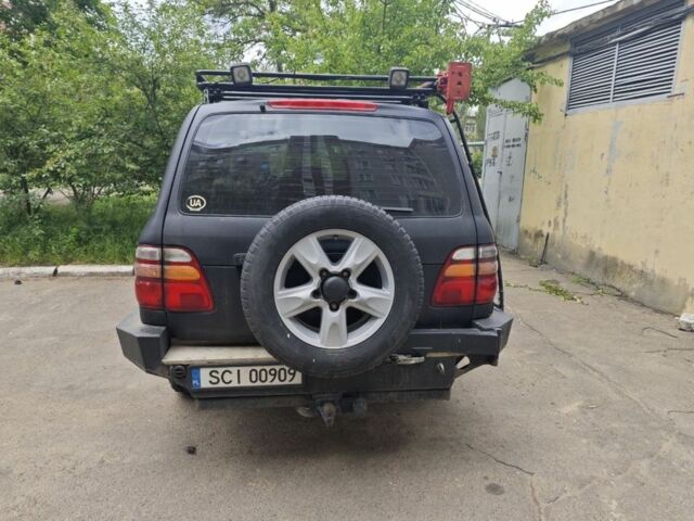 Черный Тойота Ленд Крузер 100, объемом двигателя 4.7 л и пробегом 300 тыс. км за 6000 $, фото 3 на Automoto.ua