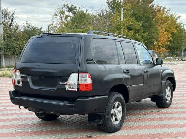 Серый Тойота Ленд Крузер 100, объемом двигателя 4.7 л и пробегом 300 тыс. км за 5950 $, фото 4 на Automoto.ua