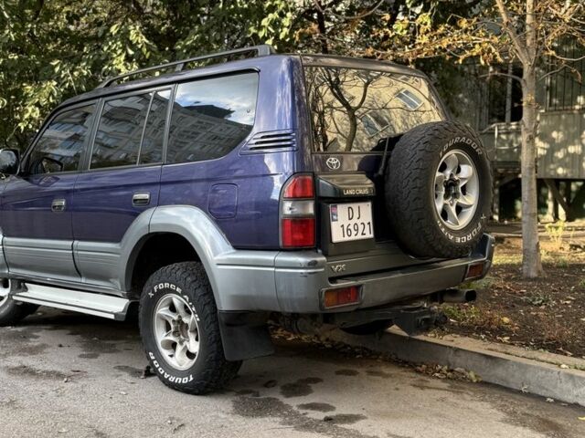 Фиолетовый Тойота Ленд Крузер Прадо 90, объемом двигателя 3 л и пробегом 397 тыс. км за 7000 $, фото 3 на Automoto.ua