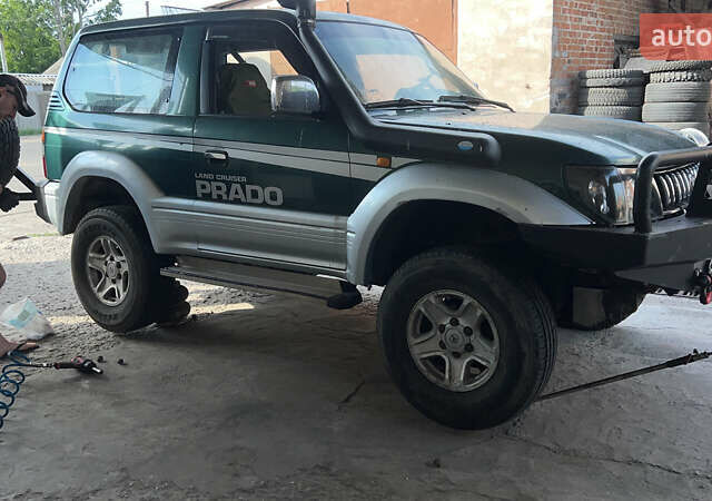 Зелений Тойота Ленд Крузер Прадо, об'ємом двигуна 3.38 л та пробігом 350 тис. км за 9999 $, фото 11 на Automoto.ua