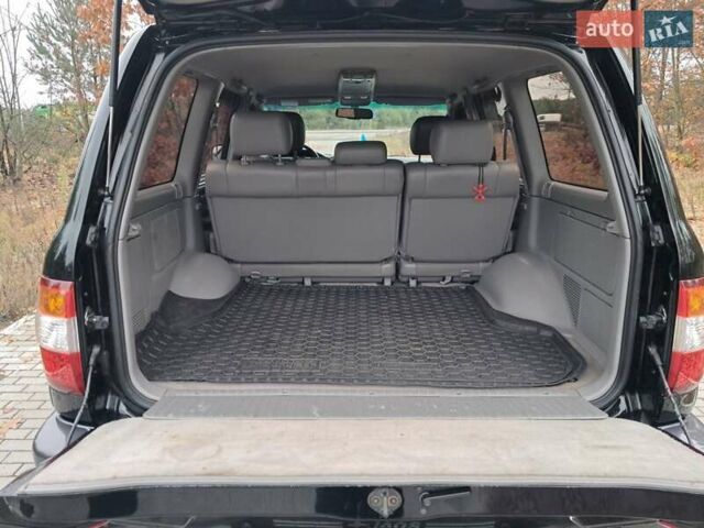 Черный Тойота Ленд Крузер, объемом двигателя 4.66 л и пробегом 337 тыс. км за 20700 $, фото 32 на Automoto.ua