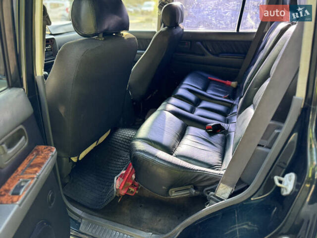 Зеленый Тойота Ленд Крузер, объемом двигателя 4.5 л и пробегом 400 тыс. км за 10500 $, фото 8 на Automoto.ua