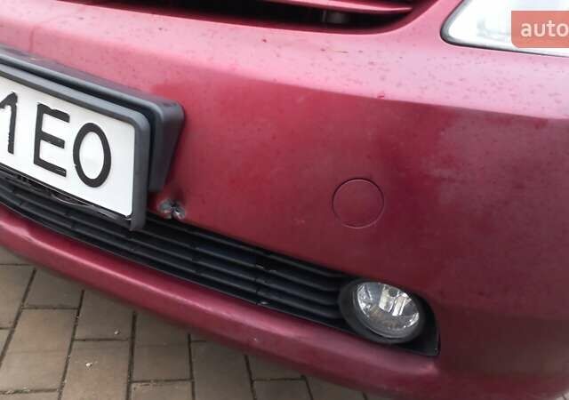 Красный Тойота Приус, объемом двигателя 1.5 л и пробегом 226 тыс. км за 6500 $, фото 3 на Automoto.ua