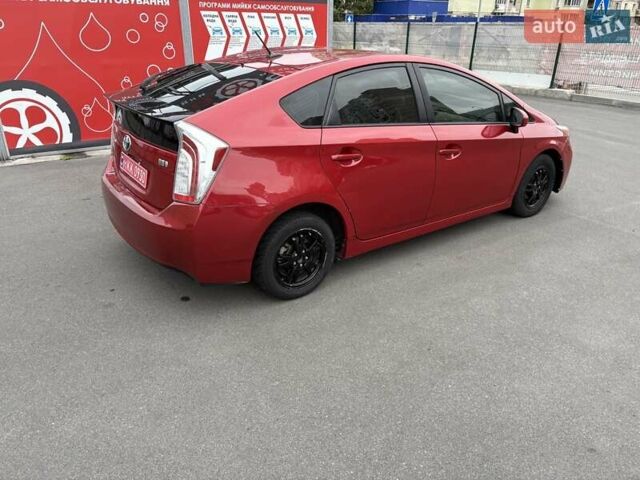 Красный Тойота Приус, объемом двигателя 1.8 л и пробегом 167 тыс. км за 12500 $, фото 1 на Automoto.ua