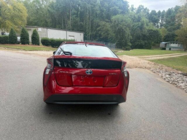 Красный Тойота Приус, объемом двигателя 1.8 л и пробегом 77 тыс. км за 8000 $, фото 6 на Automoto.ua