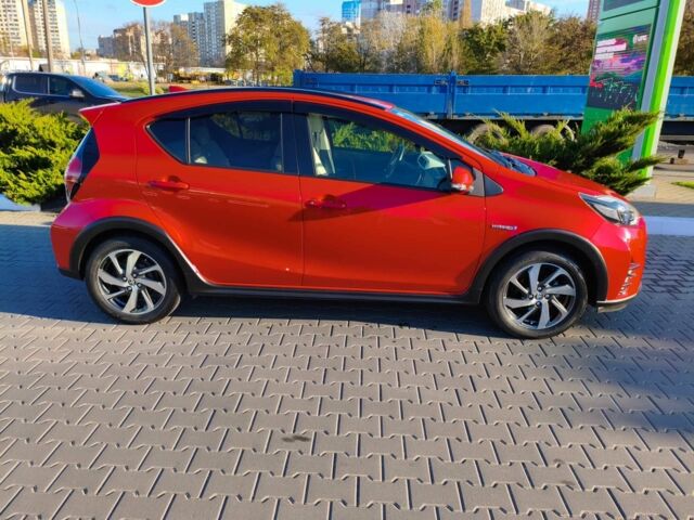 Красный Тойота Приус, объемом двигателя 1.5 л и пробегом 66 тыс. км за 14800 $, фото 1 на Automoto.ua