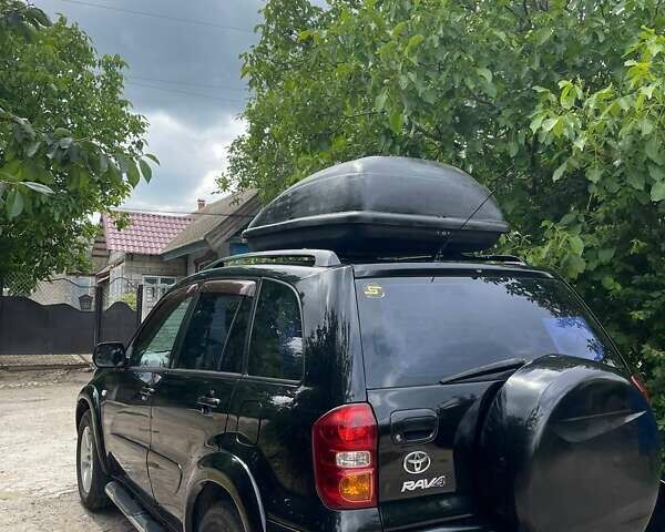 Чорний Тойота РАВ 4, об'ємом двигуна 2 л та пробігом 265 тис. км за 6699 $, фото 3 на Automoto.ua