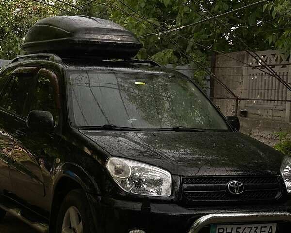 Чорний Тойота РАВ 4, об'ємом двигуна 2 л та пробігом 265 тис. км за 6699 $, фото 6 на Automoto.ua