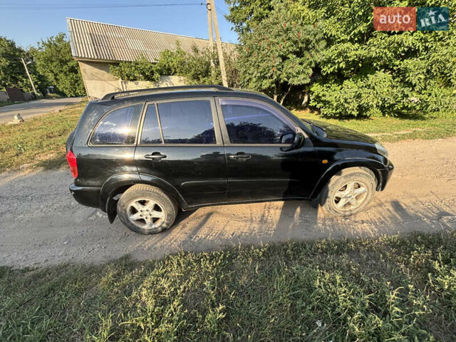 Черный Тойота РАВ 4, объемом двигателя 2 л и пробегом 493 тыс. км за 5500 $, фото 4 на Automoto.ua