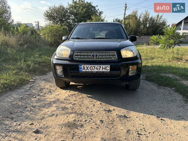 Черный Тойота РАВ 4, объемом двигателя 2 л и пробегом 493 тыс. км за 5500 $, фото 1 на Automoto.ua