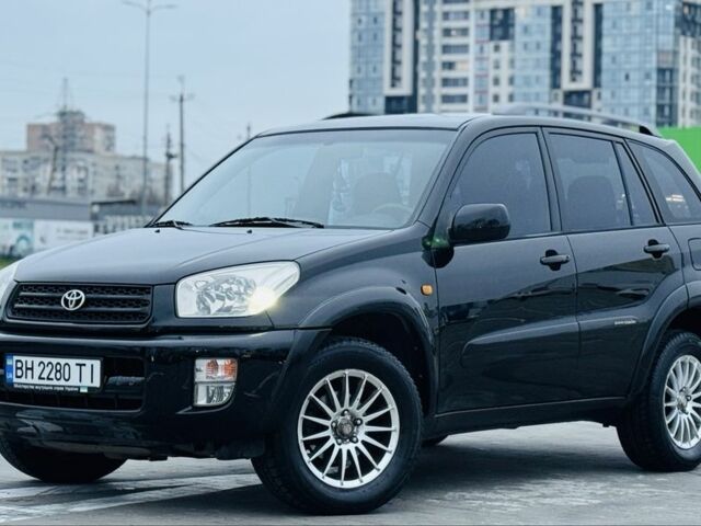 Черный Тойота РАВ 4, объемом двигателя 2 л и пробегом 205 тыс. км за 5900 $, фото 2 на Automoto.ua