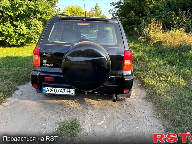 Чорний Тойота РАВ 4, об'ємом двигуна 2 л та пробігом 493 тис. км за 4999 $, фото 1 на Automoto.ua