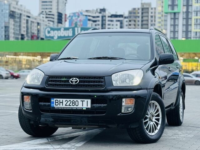 Черный Тойота РАВ 4, объемом двигателя 2 л и пробегом 205 тыс. км за 5900 $, фото 1 на Automoto.ua