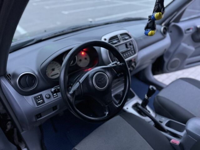 Черный Тойота РАВ 4, объемом двигателя 2 л и пробегом 205 тыс. км за 5900 $, фото 20 на Automoto.ua